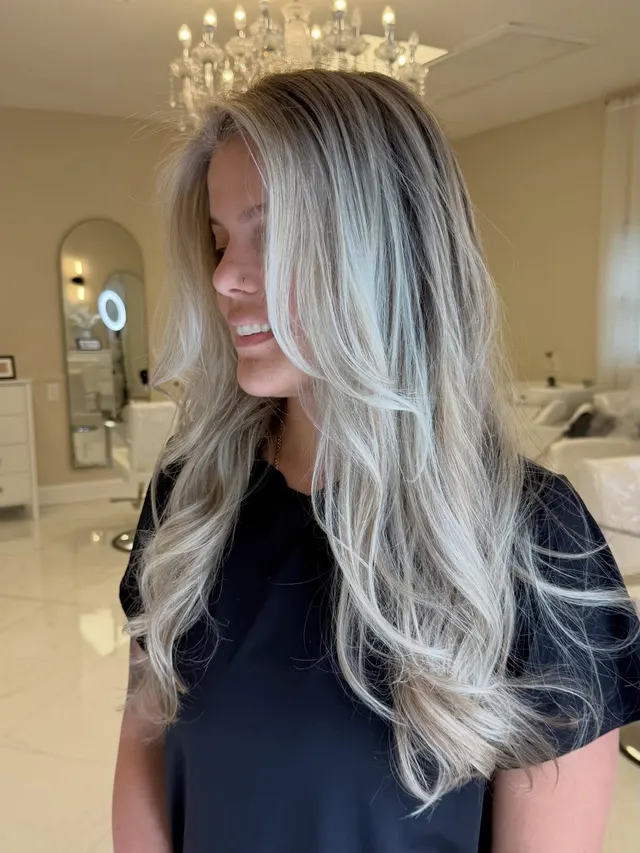 Light blonde hair styled in soft waves